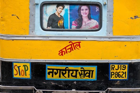 Rear of a motorised rickshaw with images of the Bollywood stars Sharukh Khan and Khajol
