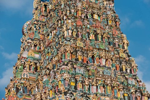 Colourful statues of gods and demons on the Gopuram or Gopura gate tower