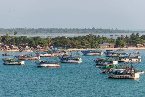 Fishing boats and fishermen's huts on the coast