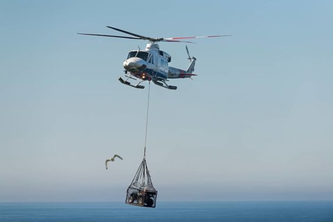 Atlantic Airways helicopter transporting a quad bike