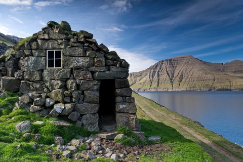 Old stone house on a fjord