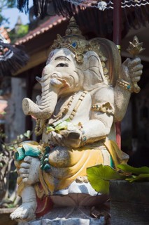 Stone figure of Ganesha with an umbrella