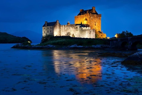 Eilean Donan Castle illuminated at dusk