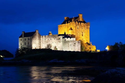 Eilean Donan Castle illuminated at dusk