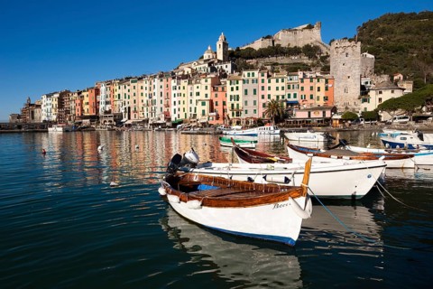 Fishing boats in the harbour in front of the historic town centre of Porto Venere