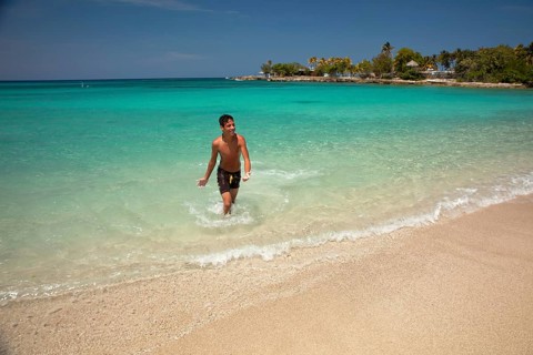 Young Cuban man on Playa Bacuranao beach