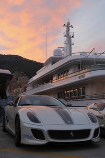 Ferrari in front of the motoryacht 'Siran' in Port Hercule at twilight