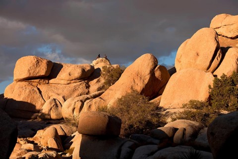 Climbers on top of a rock