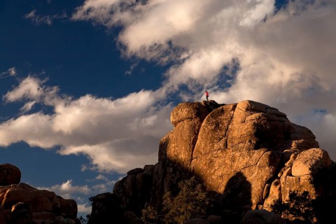Climber on top of a rock