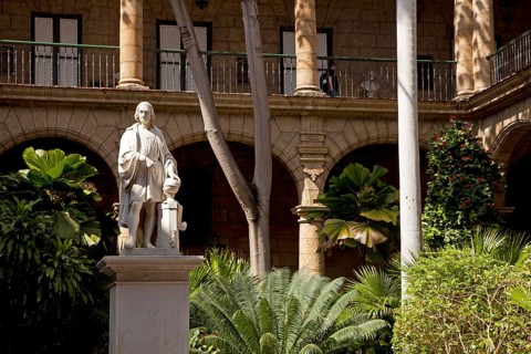 Marble statue of Christopher Columbus in the courtyard of the Palacio de los Capitanes Generales