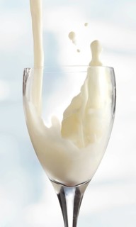 Fresh milk being poured into a glass
