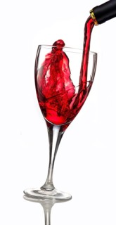 Red wine being poured into a glass