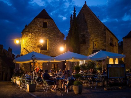 Visitors to the Brasserie Le Medieval dining outdoors