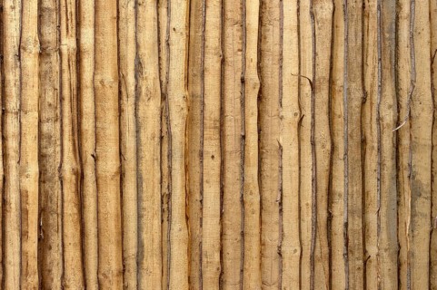 Wooden wall from untreated rough boards