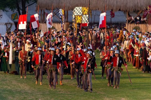 Bailiffs and flag bearers wearing medieval costumes at the showgrounds