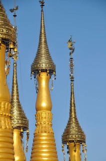 Gold-coloured stupas with golden hti
