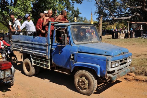 Buddhist monks and villagers on the way home from the Full Moon Festival in December