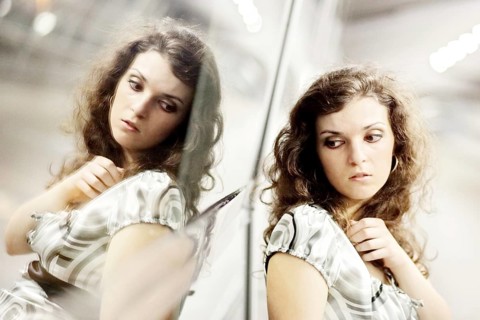 Woman and her mirror image