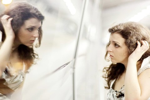 Woman and her mirror image