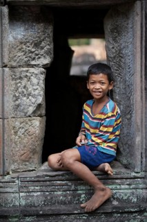 Boy in the temple complex of Preah Khan or Prah Khan
