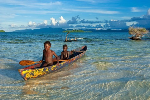 Boys in a canoe in the Marovo Lagoon