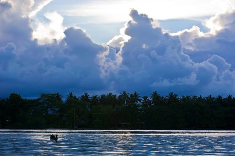 Boys in a canoe in the Marovo Lagoon