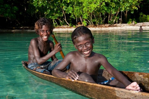 Local boys in a canoe in the Marovo Lagoon