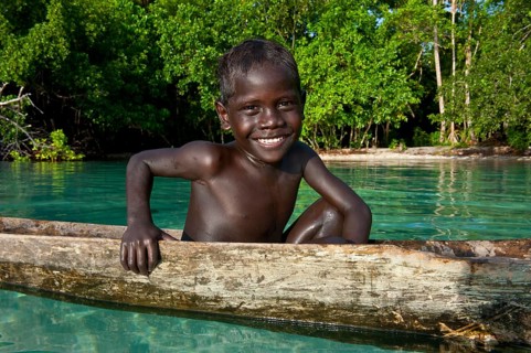 Local boy in a canoe in the Marovo Lagoon