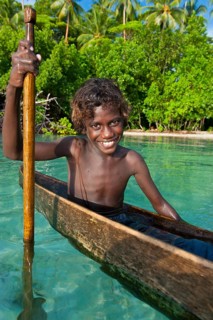 Local boy in a canoe in the Marovo Lagoon