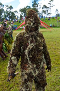Man covered in moss at the traditional sing-sing gathering