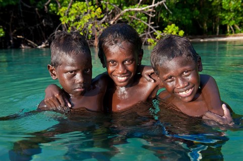 Local boys in the water of the Marovo Lagoon