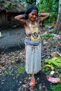 Colourfully decorated and painted woman celebrating the traditional Sing Sing in the highlands