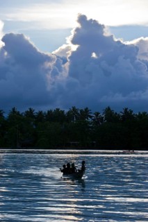 Boys in a canoe in the Marovo Lagoon