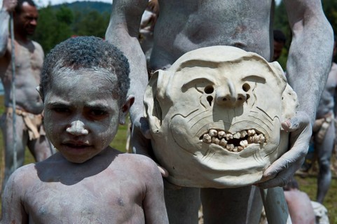 Boy from the tribe of the Mudmen during the traditional Sing Sing in the highlands
