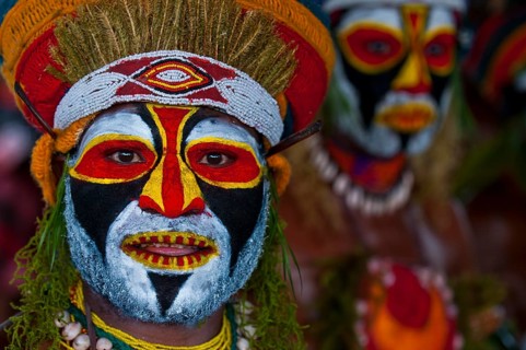 Colourfully decorated and painted men celebrating the traditional Sing Sing in the highlands