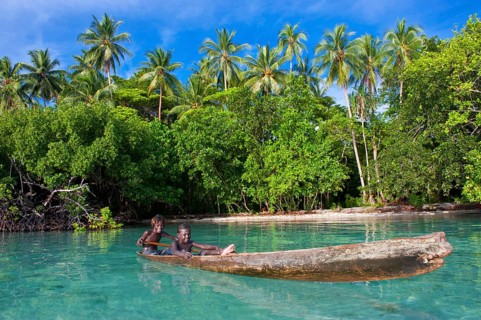 Local boys in a canoe in the Marovo Lagoon