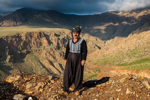 Kurdish shepherd standing on the edge of a canyon right above Ahmed Awa