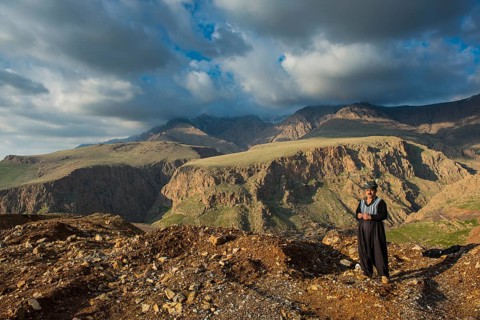 Kurdish shepherd standing on the edge of a canyon right above Ahmed Awa