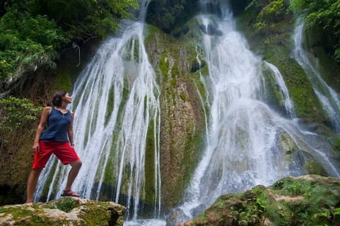 Woman looking at the Mele-Maat Cascades
