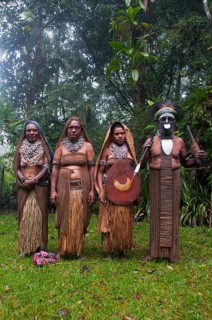 Tribal chief and three women wearing traditional dresses
