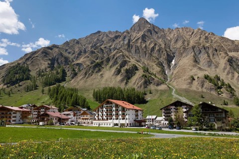 View of the village of Samnaun with Mt Piz Ot