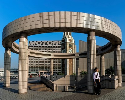 Man leaning against a pillar on a round structure at the Cultural Centre