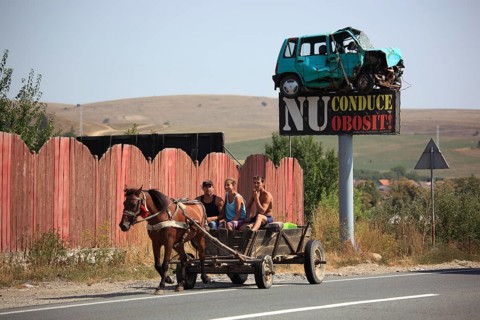 Horse-drawn carriage in traffic