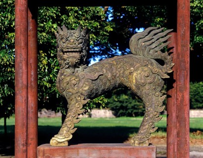Bronze lion sculpture in the park of the Imperial Palace of Hoang Thanh