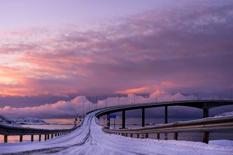 Bridge with snow-covered road in the evening light