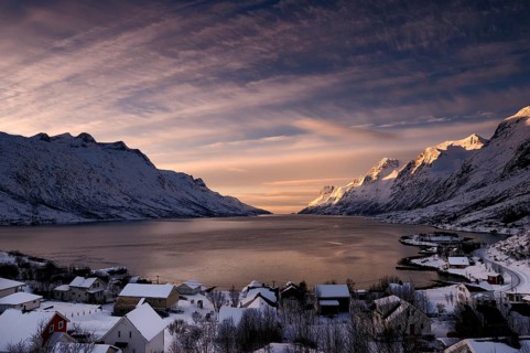 Fjord with small town in the evening light