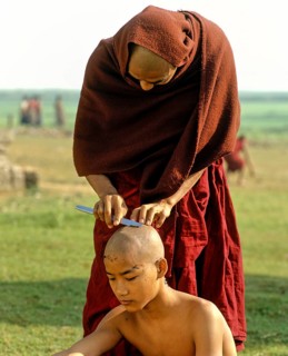 Novice having his hair shaved