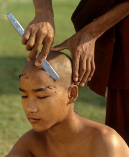 Novice having his hair shaved