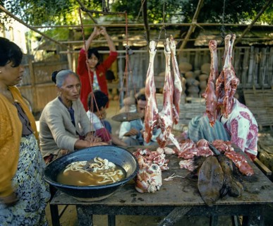 Woman selling meat at a market