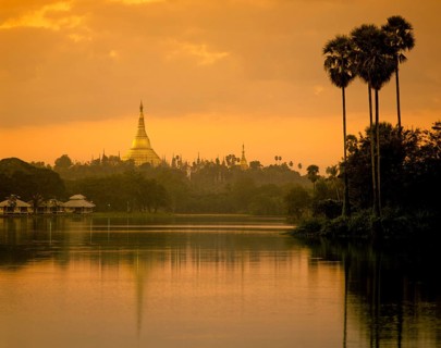 Lake Kandawgyi with Shwedagon Pagoda at twilight